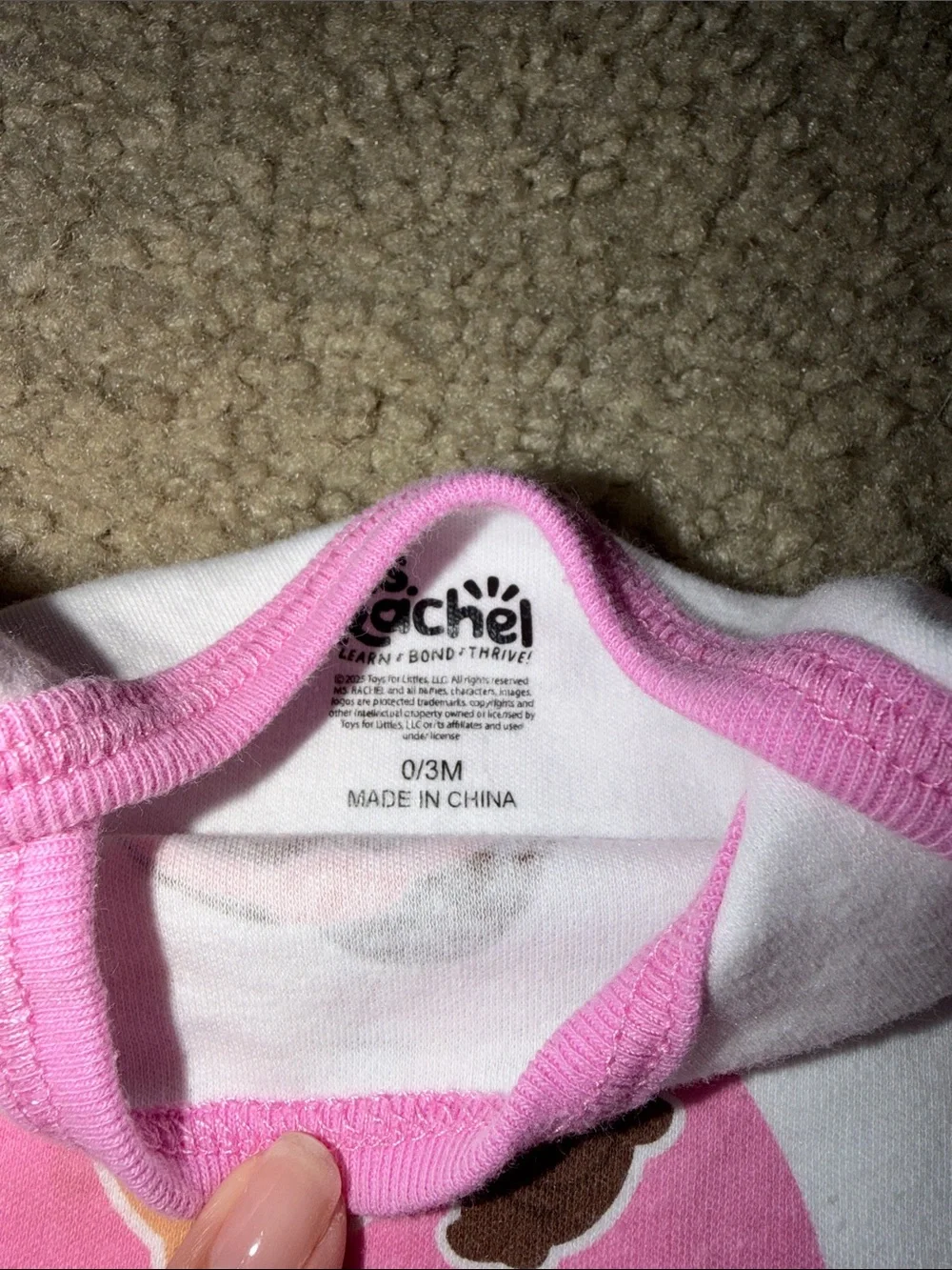 White and Pink Baby One-Piece Bodysuit with Friendly Character Graphic